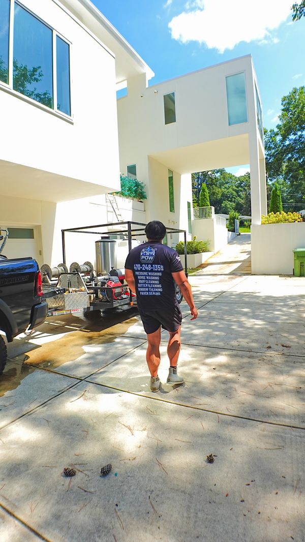 POW technician and pressure washing rig on a job in metro Atlanta